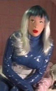 Blue Polyurethane - Verri loves her thick, shiny, creaky pu catsuit. It always gets her really hot to wear it and she turns that horniness on her dolly, fucking her deep and hard until she explodes in her.