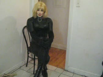 Dollification Fondle  Bound Predicament - Angelika doll prances and fondles in her catsuit, corset, female mask and locked in ankle boots, then finds herself in a bound predicament! She is cuffed and locked up, but cannot get free until the ice melts and the keys are freed! She is locked in until then!