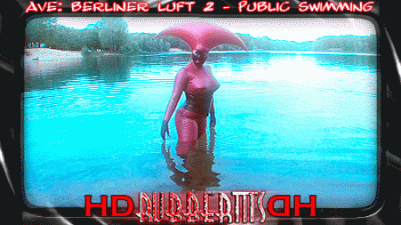 Berliner Luft 2  Public Swimming - As, always in hd! Heres the second part of aves visit in berlin. Here she takes a swim in a public swimming lake, of course in full, shiny rubbery outfit! Not much to add there, just let the video and the reactions of the people there get you aroused..:-) This is pure outdoor excitement!